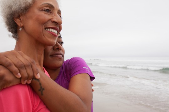 child-hugging-her-mother-on-beach